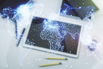 Multi exposure of abstract creative digital world map and modern digital tablet on background, top view, tourism and traveling concept