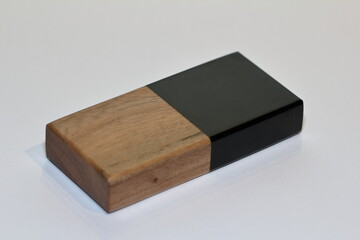 A piece of wood is filled with epoxy resin