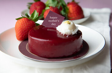 A strawberry cake is placed on a tablecloth. Romantic love, affection, Mothers Day, design concept