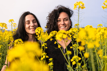 portrait of a girl in springtime in a field of yellow flowers