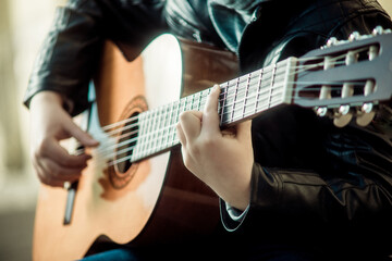 child playing guitar close-up of hands