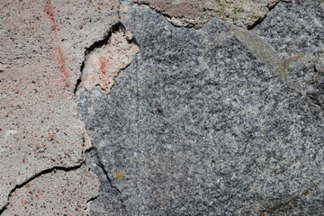 Obraz premium Texture of stone and concrete. Sunlight shining on the wall. Close up and isolated background. Copy space for extra text.