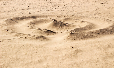 Sand texture and spiral shaped dune on the beach