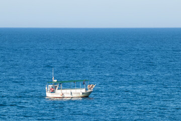 Fototapeta na wymiar boat tourists on the costa brava on a sunny summer day