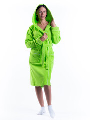 woman in a Bathrobe on an isolated white background with a smile on her face.