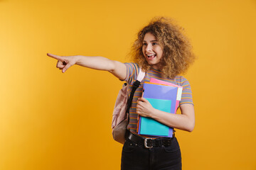 Happy young woman student with backpack