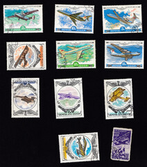 A set of postage stamps depicting airplanes. Aircraft An-28, TU-154, Yak-42, IL-86, IL-76, TU-110, Ilya Muromets, Dybrovsky, Gakkel, Steglau. Drawing on an old stamp. USSR - circa 1970.