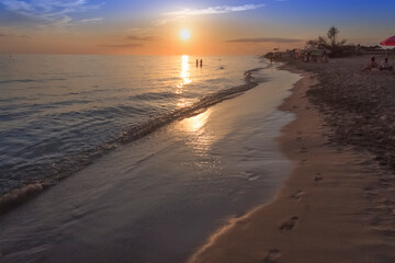 Summertime: beach sunset. Torre Mozza Beach, with its of coast with fine sand, is one of the longest and most appealing among those in the South part of Salento in Apulia, Italy