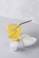 Collagen protein powder drink hydrolyzed supplement on light background. Concept of saving natural beauty and health, skin elasticity, firmness. Healthy lifestyle. Slow aging