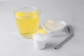 Collagen protein powder drink hydrolyzed supplement on light background. Concept of saving natural beauty and health, skin elasticity, firmness. Healthy lifestyle. Slow aging