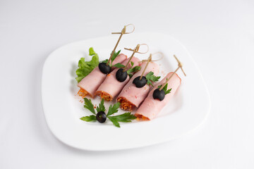 Delicious meat rolls on skewers