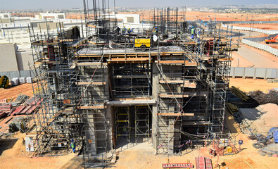 Construction works with multiple tower cranes. a new civil construction site Building in Oman. Oman city. Muscat, Oman 