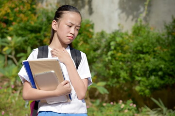 Diverse School Girl And Hopelessness Wearing School Uniform With School Books