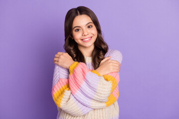 Fototapeta premium Photo of young cheerful girl happy positive smile hug herself comfort cozy isolated over purple color background