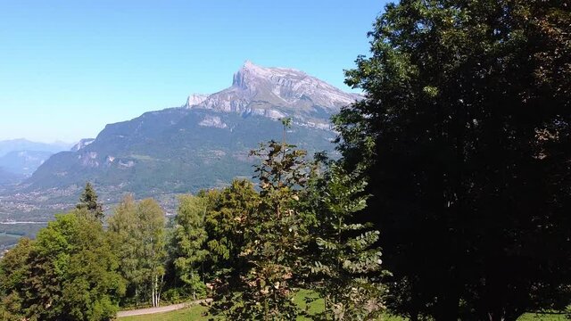 Flying upwards to reveal a valley and mountain range. Arve valley, Haute Savoie, France. Alps.