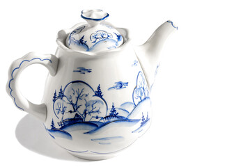 Brewing earthenware stylish teapot on an isolated white background. 