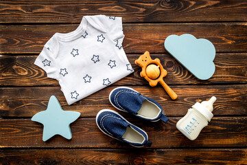 Baby accessories with bodysuit and shoes. Flat lay
