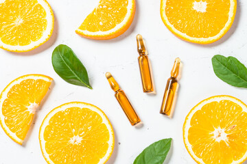 Fototapeta na wymiar Vitamin C. Cosmetic products and fresh citrus fruits.