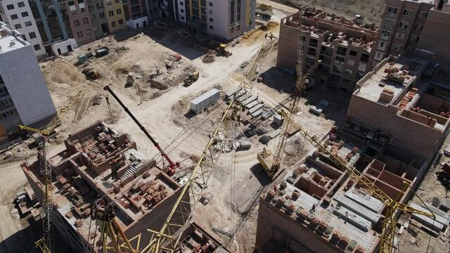 Aerial Top View Building Construction and Towel Cranes in Modern City. Construction High Rise 