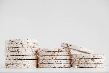 Round diet crispbreads on a white background. Round shaped cereal bread, healthy food without yeast. Copy, empty space for text