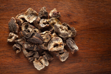 closeup of Organic Dried gooseberry or Amla (Ribes grossularia) on wooden top background.