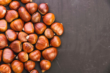 Ripe chestnuts close up. Raw Chestnuts for Christmas. Fresh sweet chestnut.