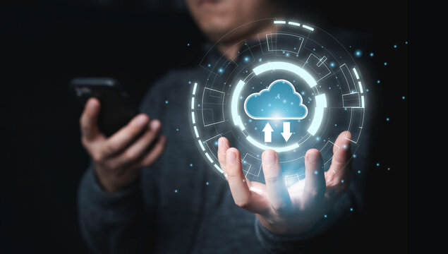 Businessman holding infographic with cloud computing and using mobile phone for download and upload information data application , cloud technology is sharing system to global.