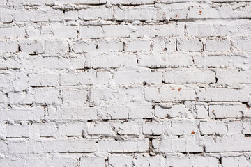 Brick wall, plastered and painted. Light white rustic background.