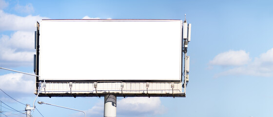 Mockup on a billboard. Advertising field on blue sky background
