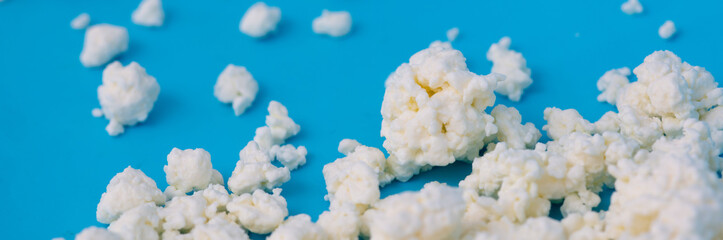 Milk curd on a blue background.