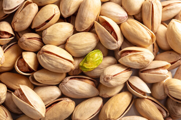 Close-up of fresh pistachio nuts as background.