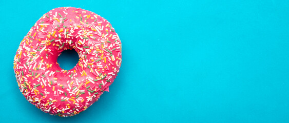 Red donut on a blue background.