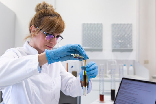 Chemist works with hemp CBDa oil in laboratory