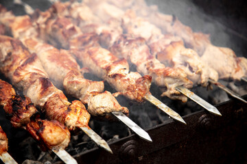 Meat on skewers is fried