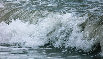 Wave in the sea with splashing water.