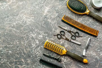 hairdressing concept with barber tools on gray background top view mock up