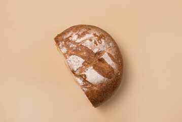 Half of Loafs Handmade Fresh Baked White Bread on Red Linen Cloth on Yellow Background Top View Horizontal
