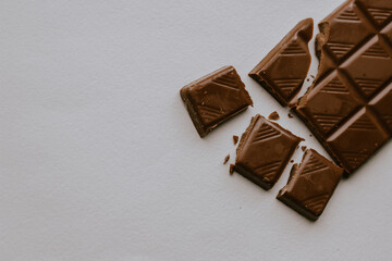 bar of chocolate close on white background