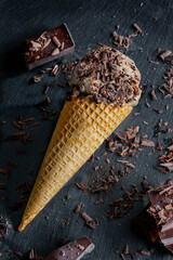 chocolate ice cream scoop cone dark background