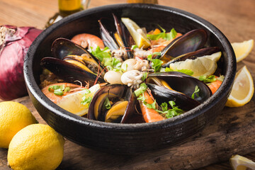 Tasty Spanish paella with seafood .