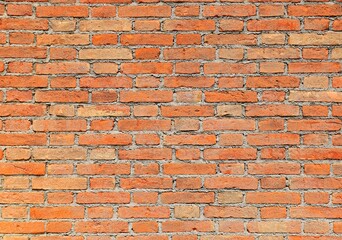 Naklejka premium wall made with red bricks and mortar