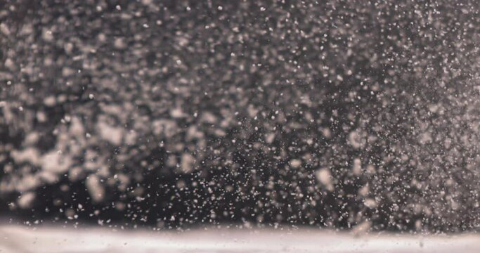 CU SUPER SLOW MOTION Woman cook chef sprinkling flour on a wooden table in bakery. Shot with high speed camera at 720 FPS