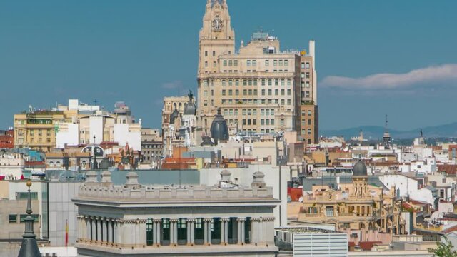 Aerial view from Cibeles Palac to Telefonica Building in Madrid timelapse with traffic on Gran Via road in a beautiful summer day, Spain