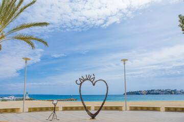 Iron sculpture in the shape of a heart in Palmanova Beach (Calvia, Mallorca) empty without people. Tourist destination in the Mediterranean