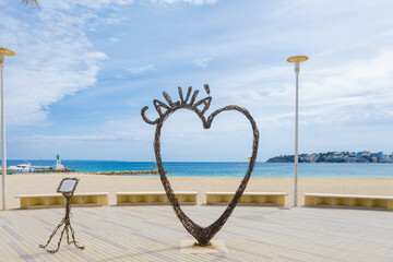 Iron sculpture in the shape of a heart in Palmanova Beach (Calvia, Mallorca) empty without people. Tourist destination in the Mediterranean