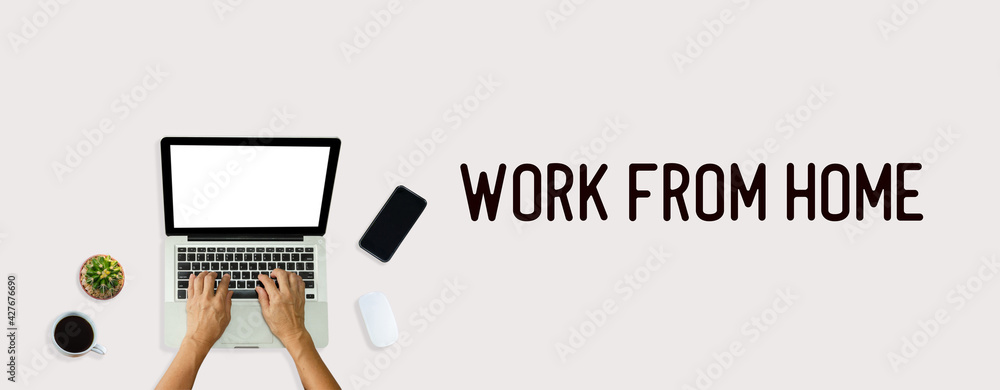 Poster hand using computer laptop from above on background. top view work from home word.
