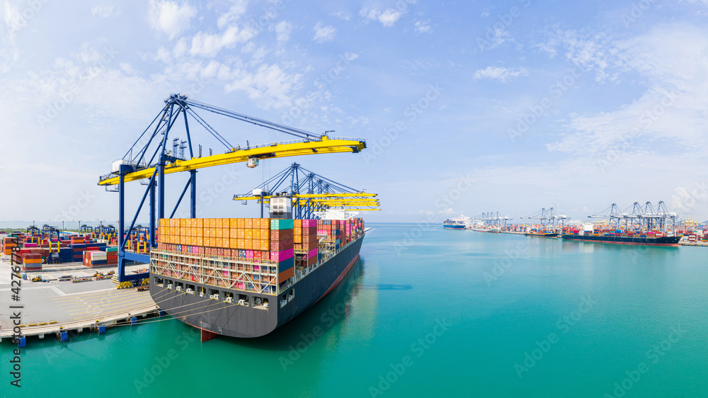 Canvas Prints ear view cargo container ship. Business logistic transportation sea freight, Cargo container in deep sea port at industrial, Cargo ship,  Crane And Unloading Containers - Canvas Prints