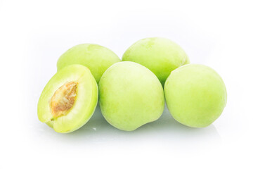 Green plum isolated on white background