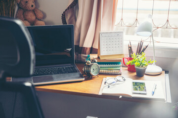 2021 Calendar desk place on table. Desktop Calender for Planner to plan agenda, timetable, appointment, organization, management each date, month, and year on wooden office table. Calendar Concept.