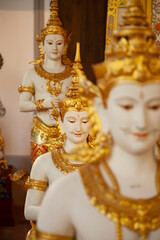 Figures and sculptures of the Buddhist culture, tradition and religion in Thailand, in the Raja Ratha Hall, part of the collection of the Bangkok National Museum.